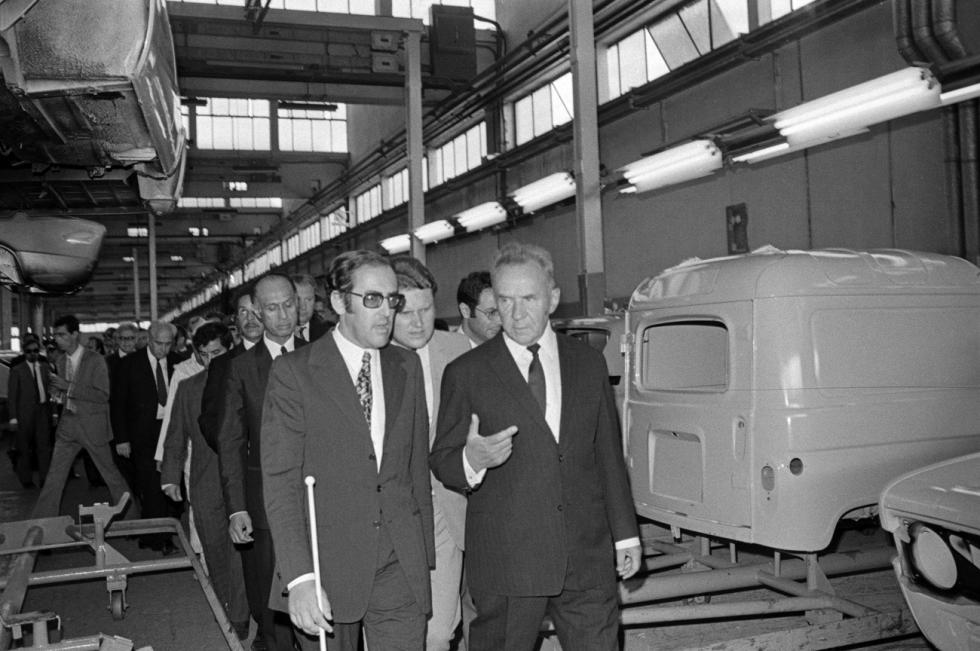 Alexei Kosygin and his party are pictured in one of the workshops of the car assembly plant 